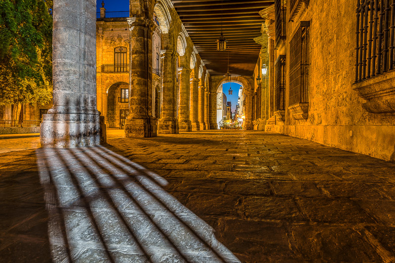 A passage under an old stone building 