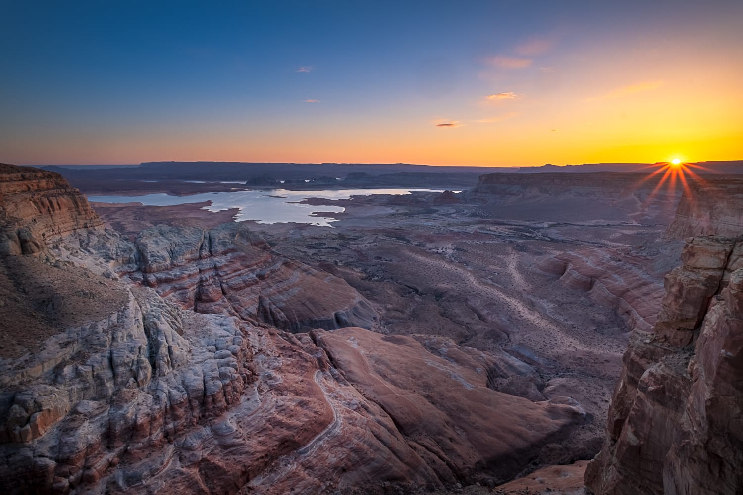 Sun setting behind mountains 