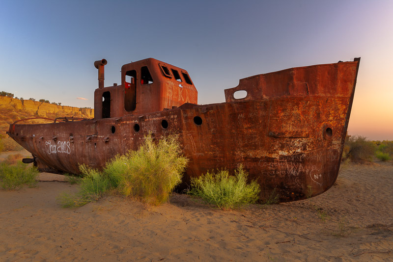 rusty boat on sand