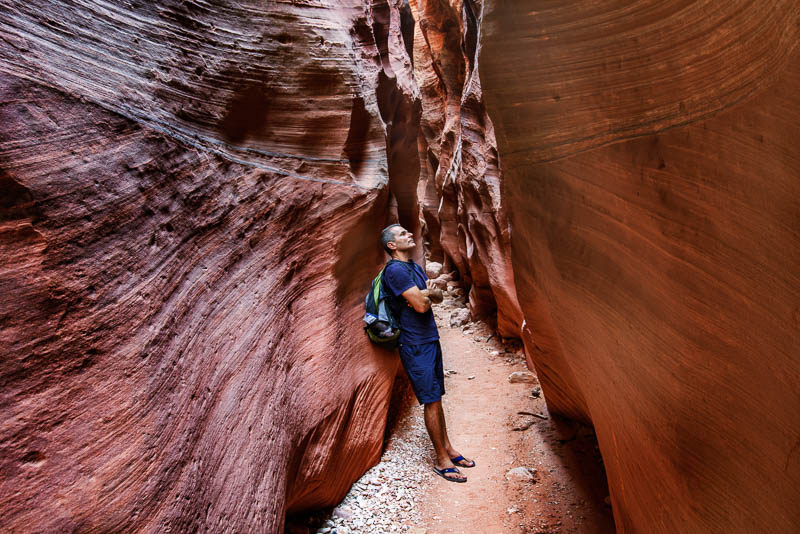 hiker in a slot canyon