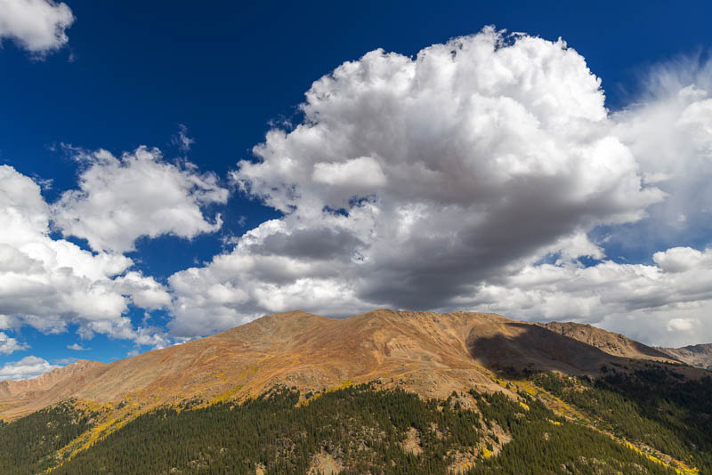 clouds above a mountain peak