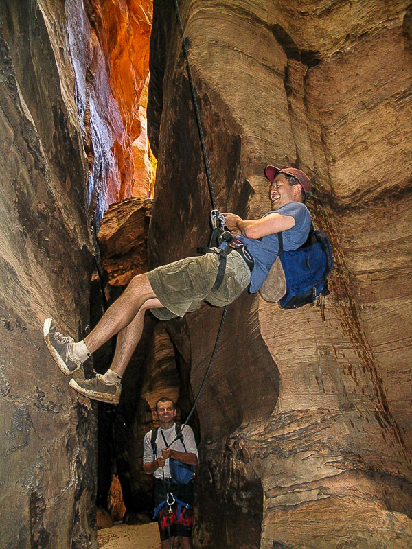 rappeling down a steep canyon