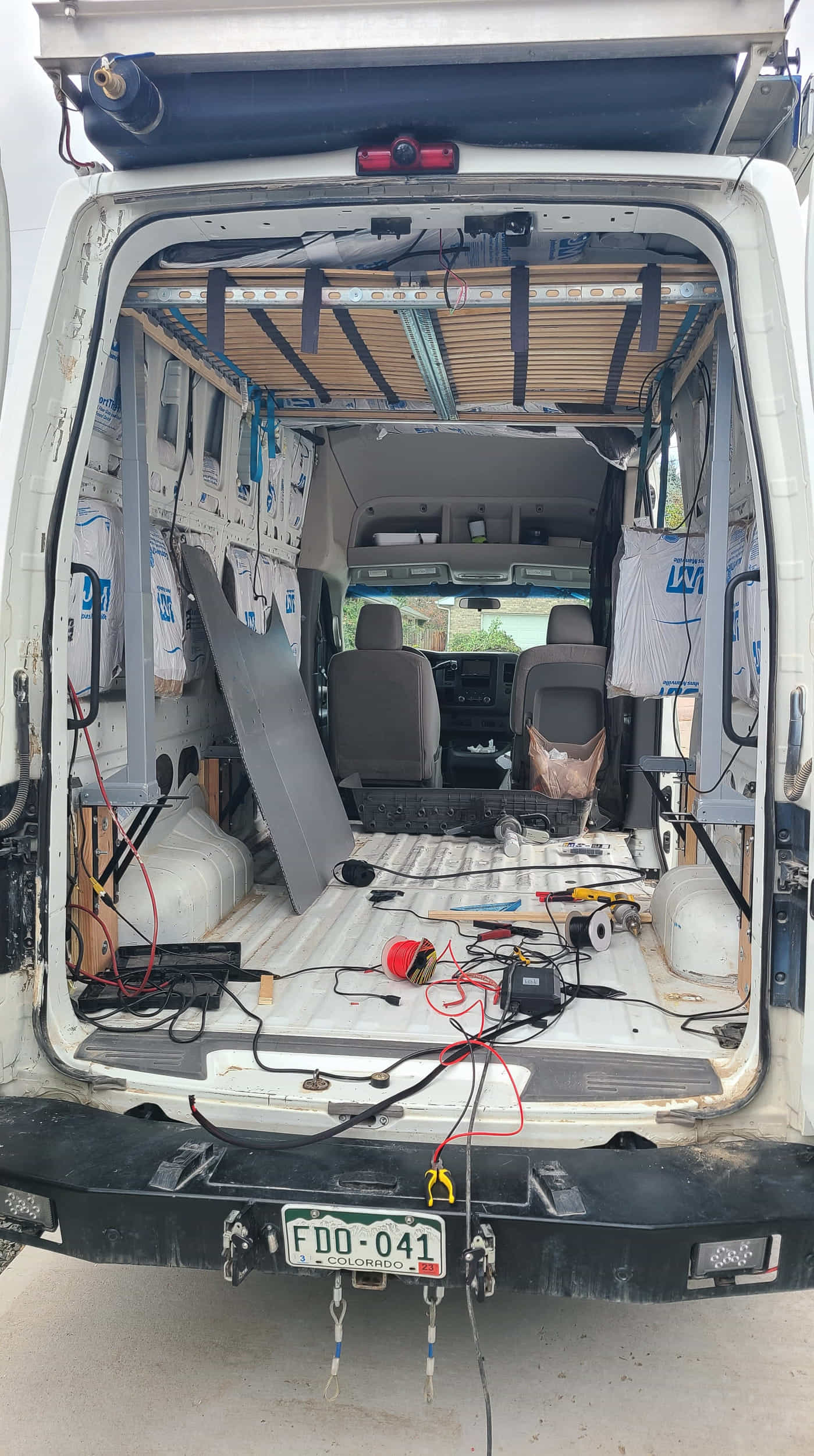 view of inside of a van with lifting bed installed