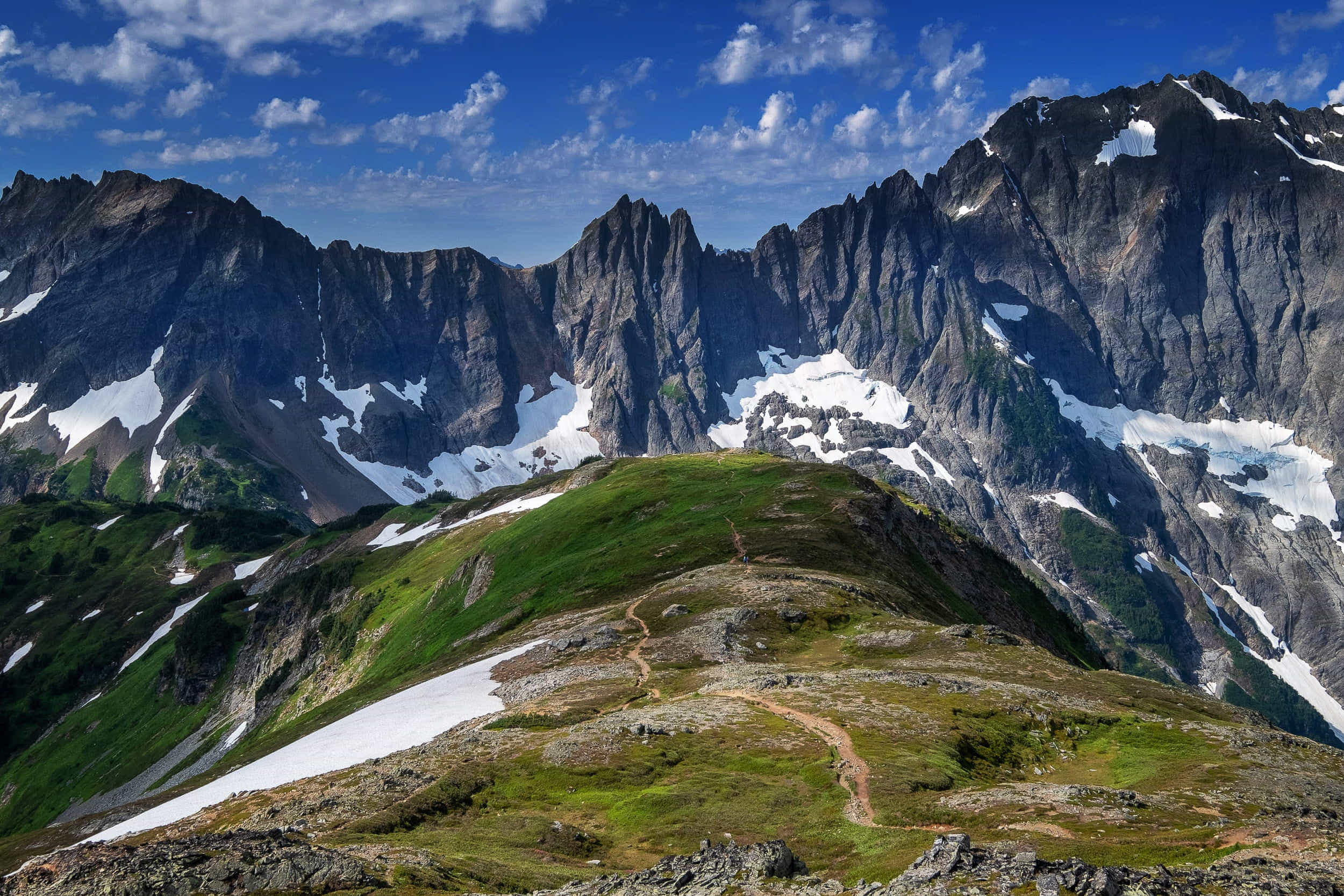 a trail snaking down mountain ridge 