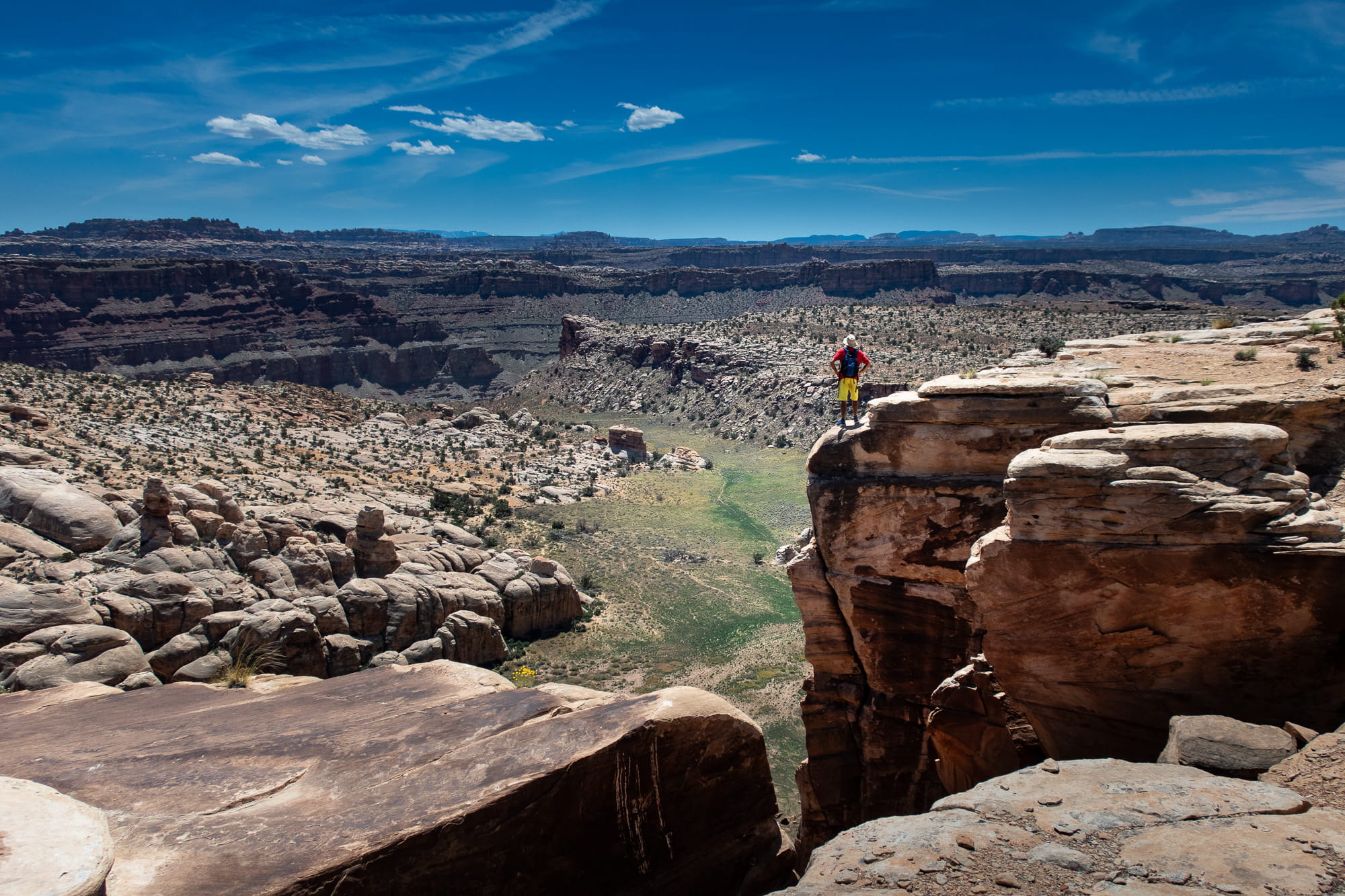 person posing at the endge of a cliff 