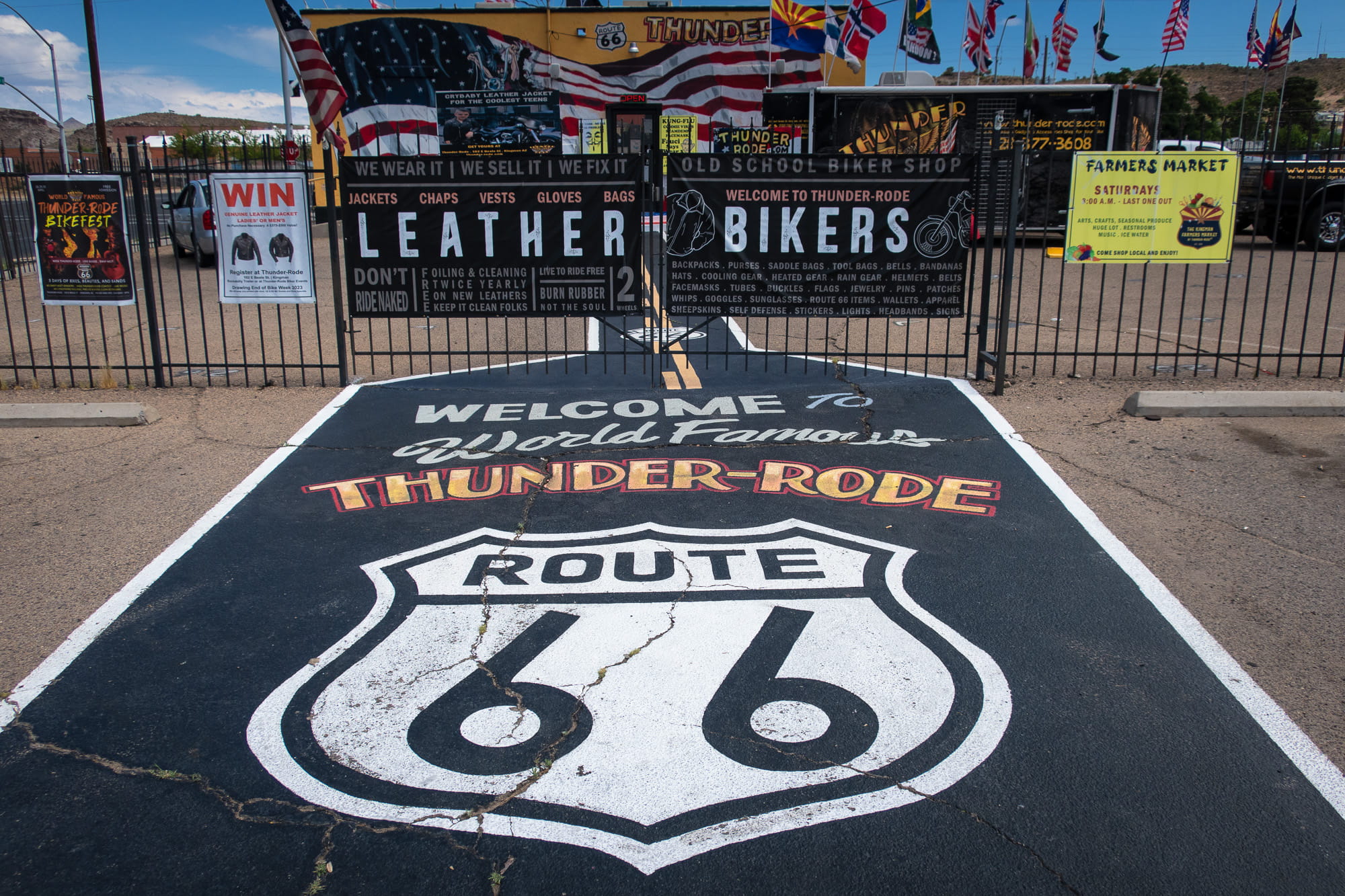 route 66 painted in front of the entrance to a motorcycle store 