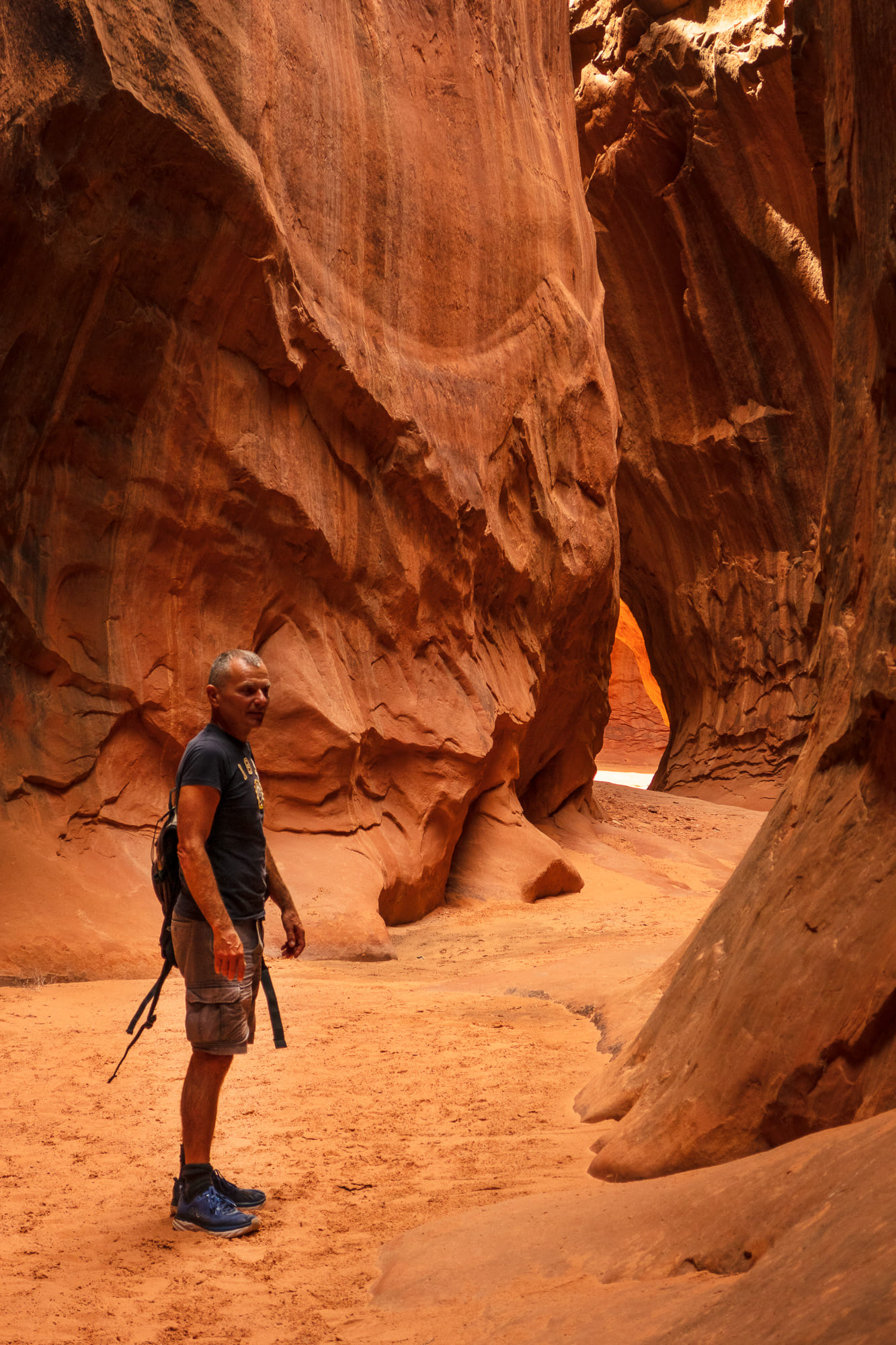 a person inside a slot canyon 