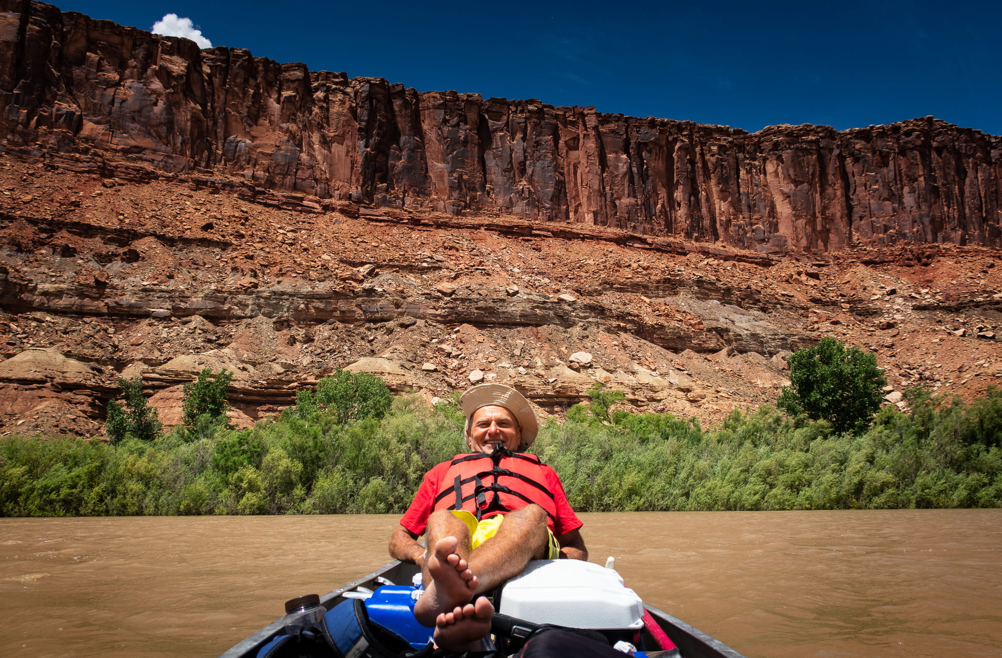 a person laying on a canoe 