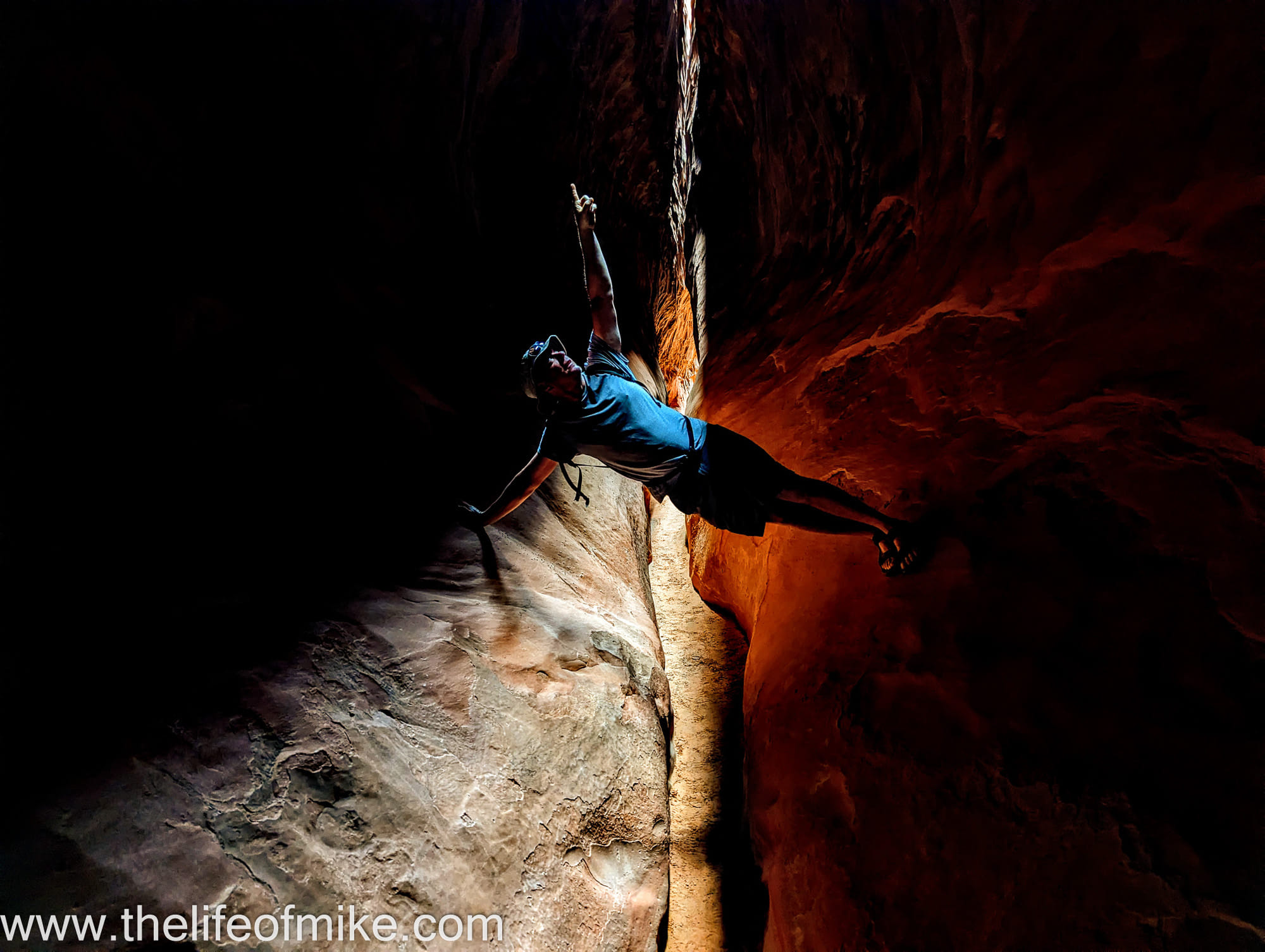 a person stradling canyon walls