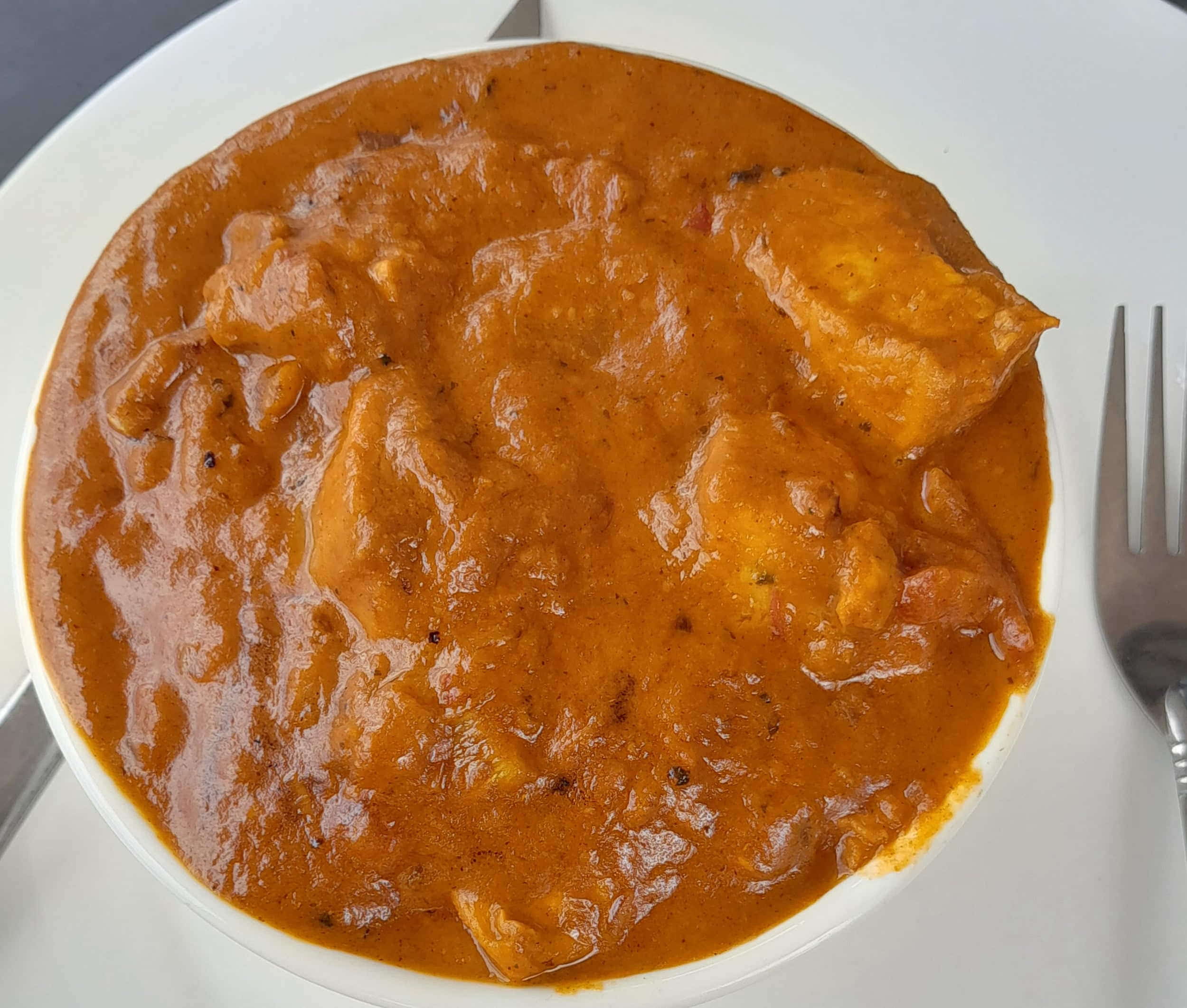 a bowl of red curry 