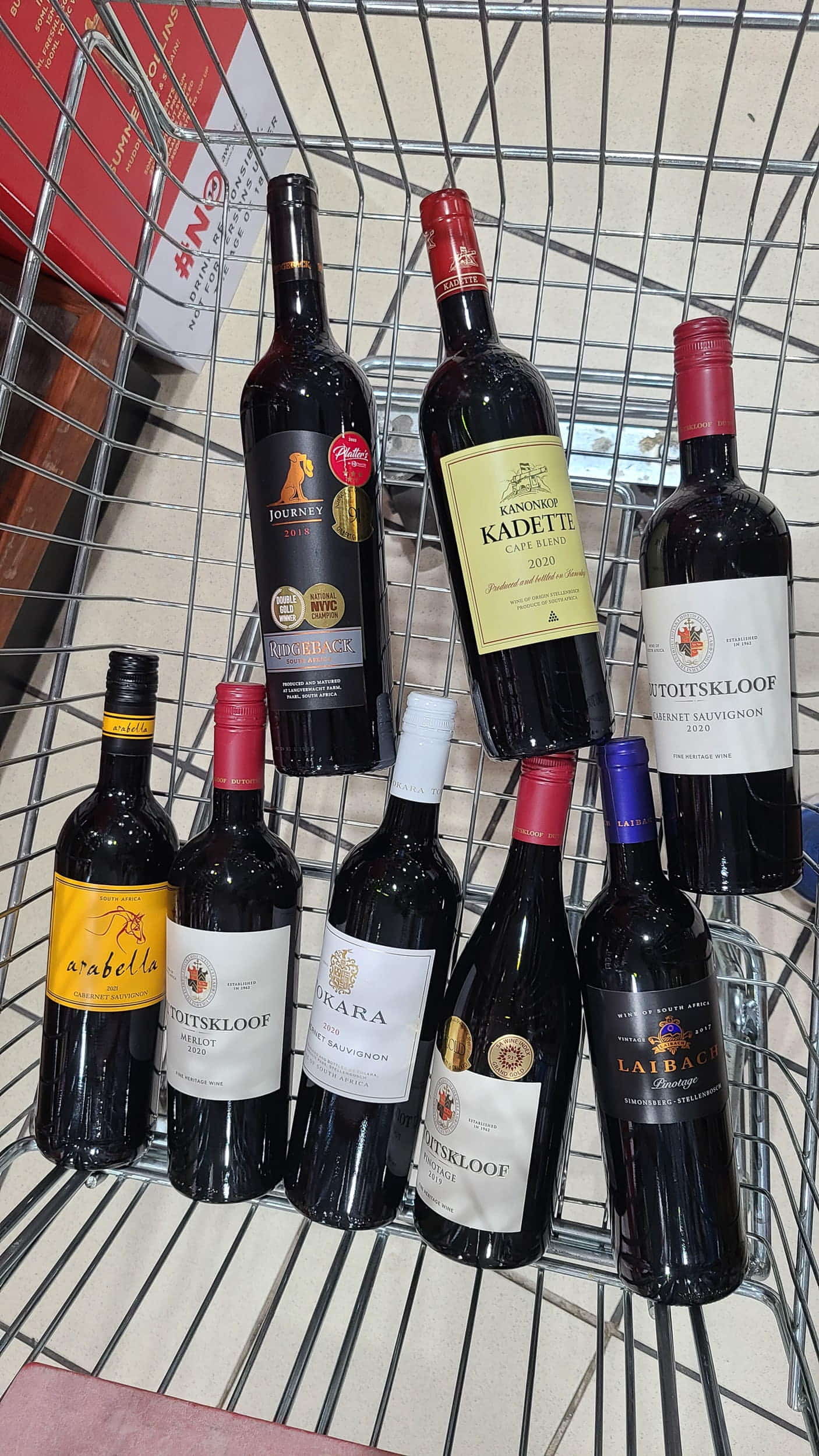 shopping cart with bottles of wine