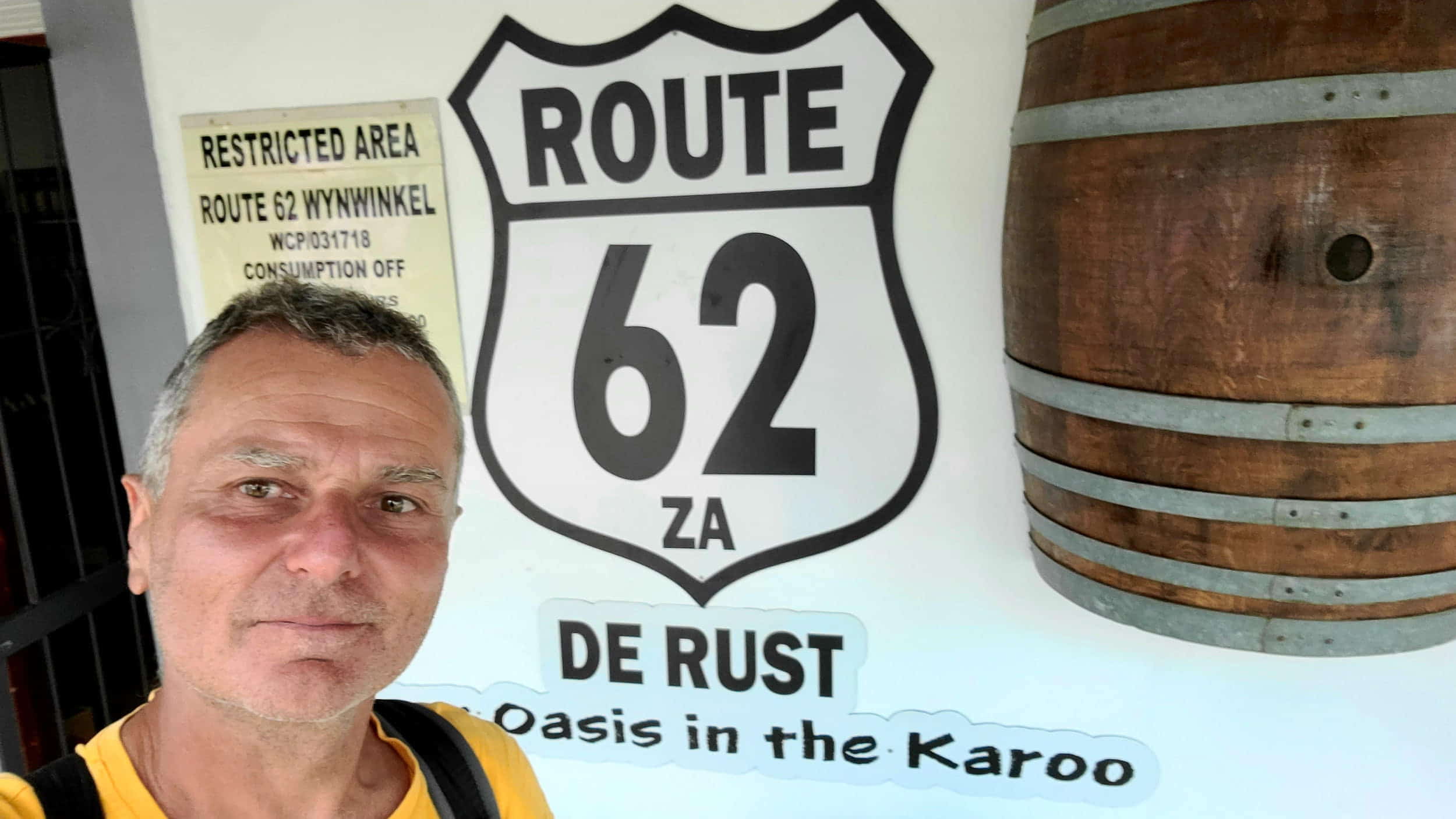 selfie next to a sign route 62