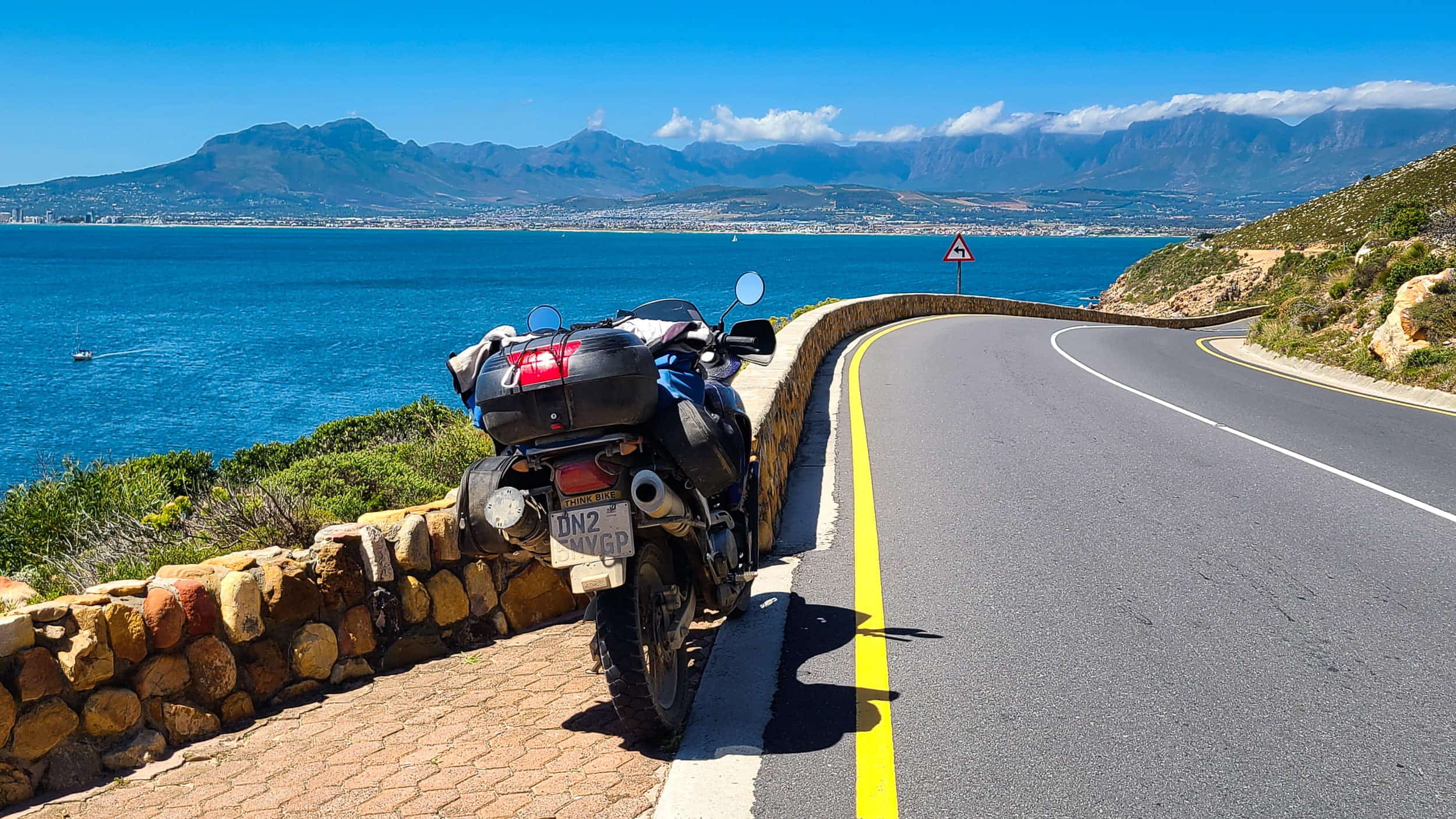 motorcycle parked on a coastal road