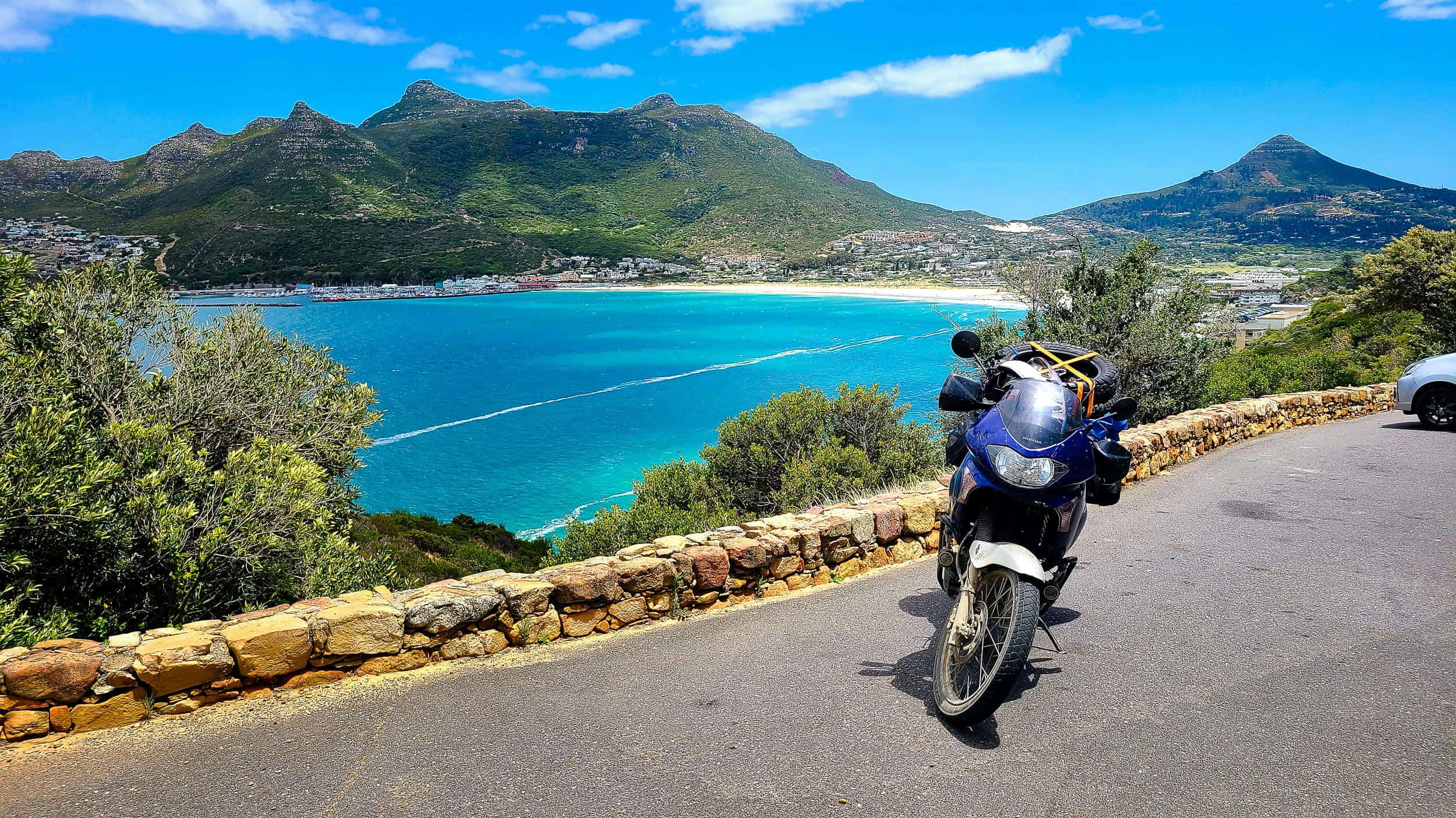 motorcycle parked with a bay behind